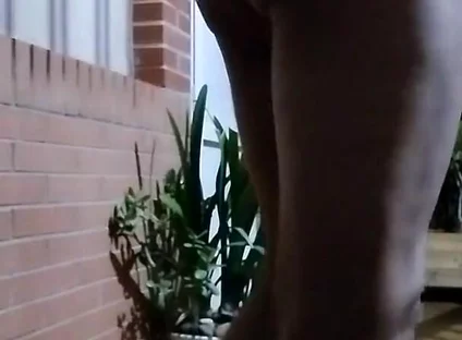 In the Doorway in a Thong and with an Anal Plug