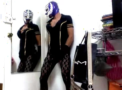 Masked Sissy Crossdresser in Dress and Stockings and Corset Lingerie