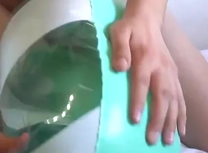 Playing with a Green and White Swimring