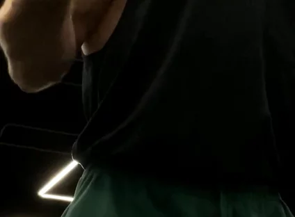 Doing a Biceps Curls with a Straight Barbell