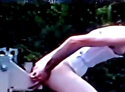 Crossdresser Riding a Giant Dildo on a Roof Top