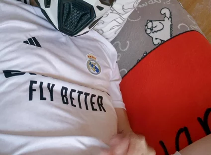 The Guy Is Wearing a Soccer Uniform and Mxhelmet with a Morning Cum