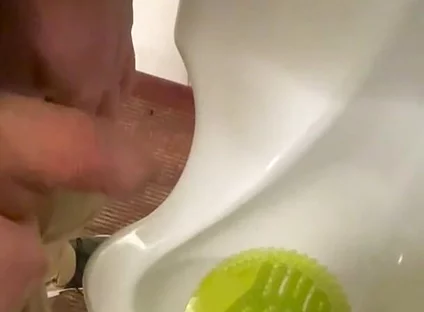 Amateur Redhead Guy Caught Pissing in a Public Toilet's Urinal - He Then Quickly Plays with His Cock Before Leaving
