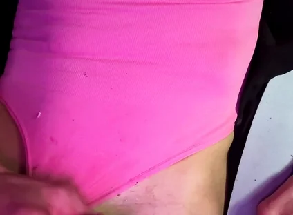 Crossdresser Michelle Wearing Pink Bodysuit While Playing with Cock