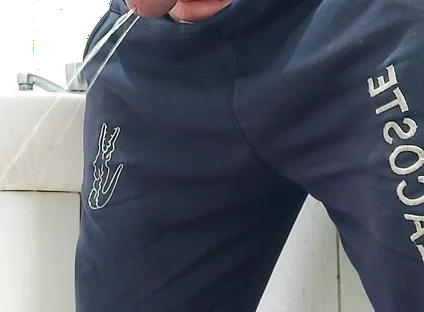 A Well-endowed Brazilian Man Urinating and Showing His Thick Penis to His Female Friends.