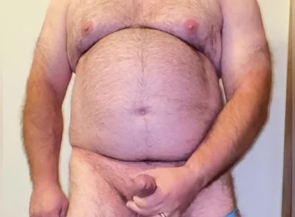 Anal Steve in His Blue Thong Showing off His Bear Body and Cock, with a Cock Ring on and Showing His Massive Butt Plug