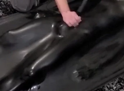 Cute twink tormented in latex vacbed