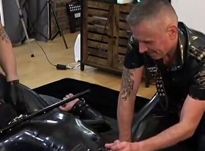 Rubber Gimp Bound and Used by Two Latex Guys Part 1