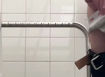 In the Hospital Toilets, a Guy Pisses Into a Cup for a Urine Sample, Then Gets Horny, Jerks-off and Cums