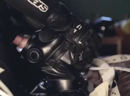 Rubber boy sucking biker master cock