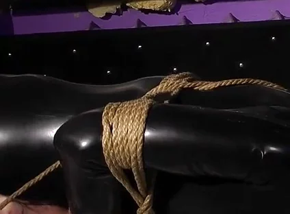 Roped in Latex: Zeus Struggles to Break Free