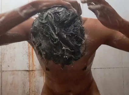 Exotic Skinned Adult Man Taking a Bath in the Afternoon
