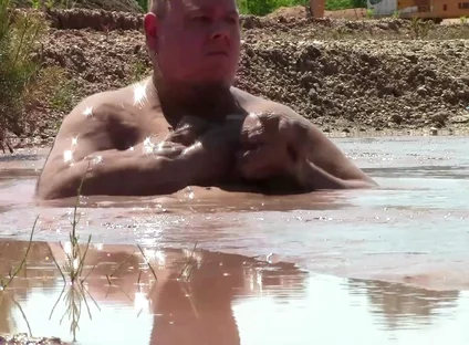 Deep, Creamy Brown Mud Bath in a Sand Pit