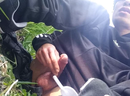 Gay boy Jon Arteen, wearing adidas tracksuit Campus sneakers, gets a hard-on outdoors