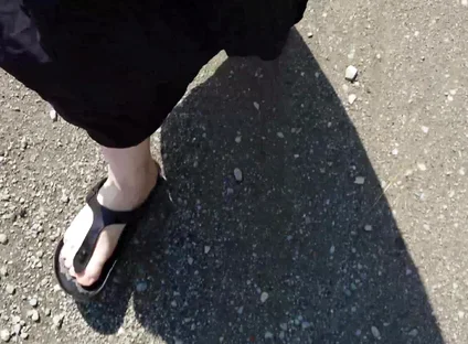 Outdoor in a Black Caftan and Barefoot in Black Birkenstocks
