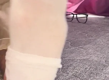 A University Rests Her Feet on Her Face so That the Adorers