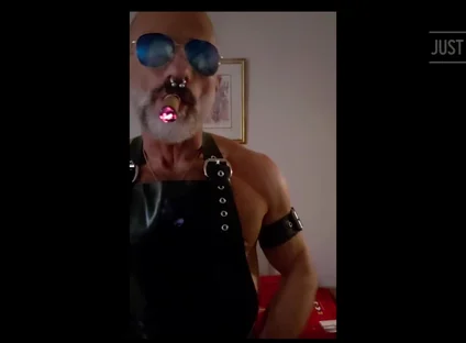 Stepdad lighting his Cigar in rubber apron