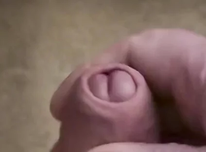 My Friend Sits in a Chair and Jerks off His Cock While Watching Video