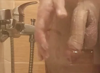 A Young Guy Washes in the Shower and Dreams of Someone Being Next to Him