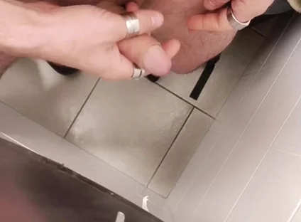 Jerking off a Cock in a Public Toilet