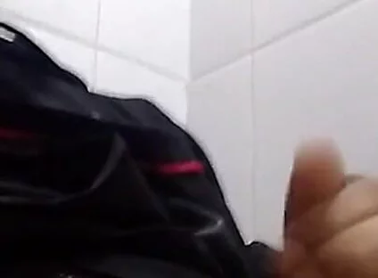 Man Sits in the Bathroom